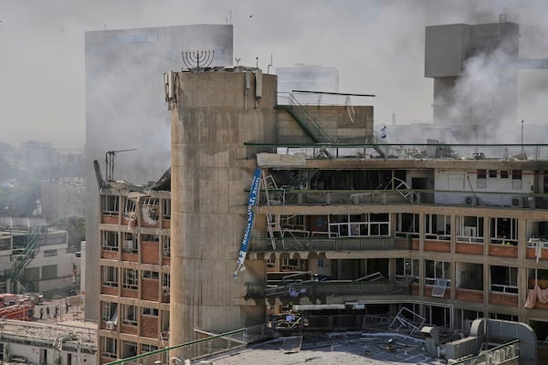 Smokes raises from a building of the Soroka hospital complex after it was hit by a missile fired from Iran in Be'er Sheva, Israel, Thursday, June 19, 2025. (AP Photo/Leo Correa)