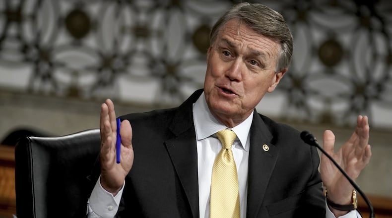 Sen. David Perdue, R-Ga., asks questions during the Senate Armed Services Committee hearing on the Department of Defense Spectrum Policy and the Impact of the Federal Communications Commission’s Ligado Decision on National Security during the COVID-19 coronavirus pandemic on Capitol Hill in Washington, Wednesday, May 6, 2020. (Greg Nash/Pool via AP)