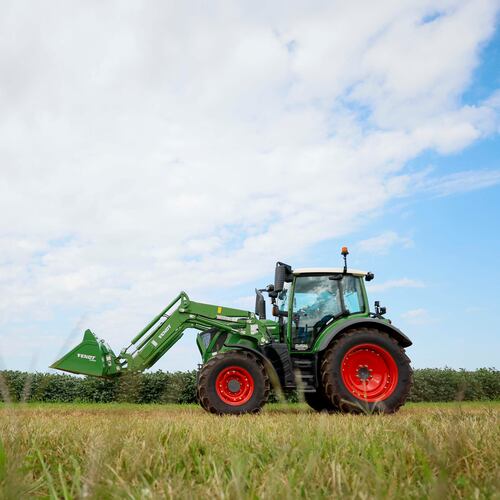 A tractor moves beside a soybean field at Iron Horse Farm with the J. Phil Campbell Sr. Research and Education Center during a demonstration of how they work with precise harvesting using the latest technology from Georgia-based AGCO on Monday, Sept. 8, 2025. AGCO has extended its lease for its Gwinnett County headquarters. (Miguel Martinez/AJC)