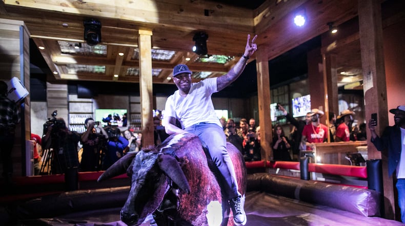 Andruw Jones rides the mechanical bull, "Druw," at PBR Atlanta. Photo credit: Jeff Roffman Photography