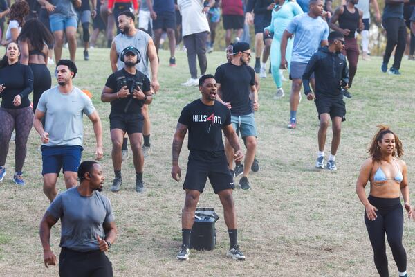 Alvin Bailey (center) leads the Hills4ATL fitness group exercise event at Piedmont Park on Wednesday, March 25, 2026, in Atlanta. (Arvin Temkar/AJC)