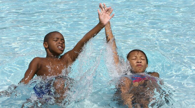 Marcus Lazenberry, left, age 7, and his sister Kristen Lazenberry, right, age 11, of Duluth do the backstroke in the pool at the West Gwinnett Aquatic Center in Norcrossin 2008. Kimberly Smith/ ksmith@ajc.com