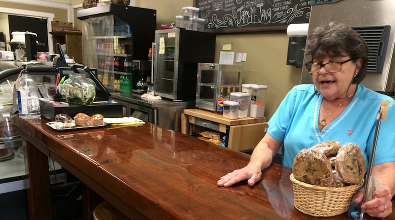 Rebba Storey works at the counter of the Jam-N-Java Bakery and Coffeehouse in West Point. The counter used to be part of Lanett Mill, a textile mill that has long since shut down. The textile industry was on a downturn before the North American Free Trade Agreement took effect, but the trade pact dealt one of the final blows. “We came to work one day and the gate was locked,” said Storey, who was a human resources manager at another mill. “No notice, no checks, no severance.”