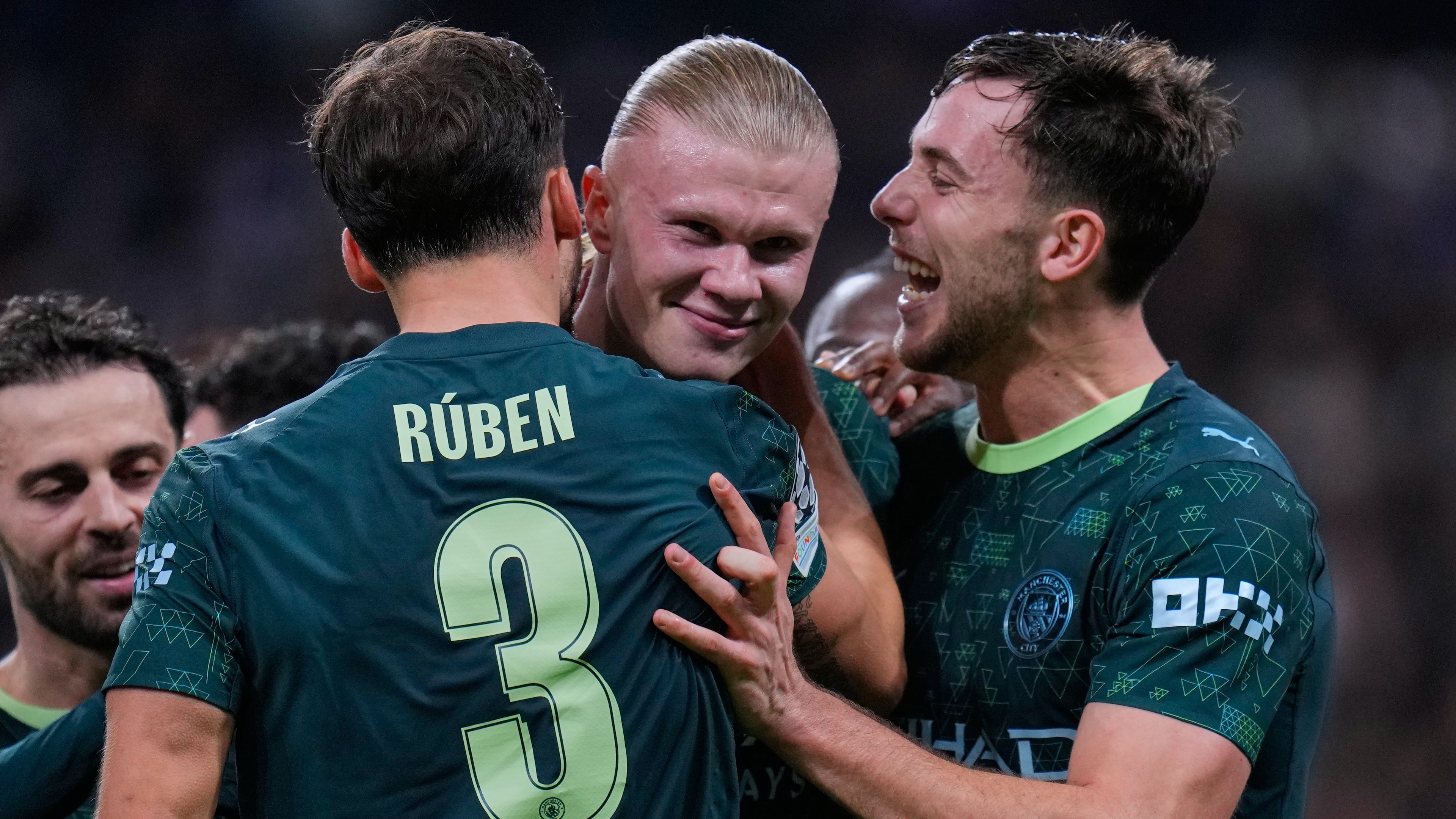 Manchester City's Erling Haaland, center, celebrates with teammates after scoring their side's second goal during a Champions League opening phase soccer match between Real Madrid and Manchester City, in Madrid, Spain, Wednesday, Dec. 10, 2025. (AP Photo/Manu Fernandez)