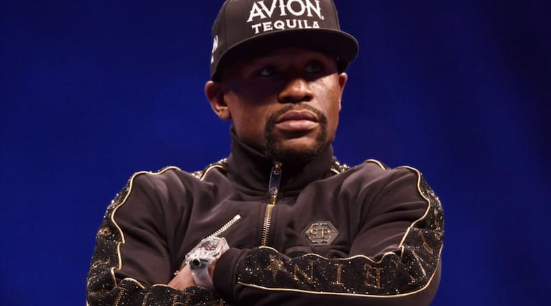 Floyd Mayweather Jr. sits onstage during a news conference after Mayweather's 10th-round TKO victory in their super welterweight boxing match on August 26, 2017 at T-Mobile Arena in Las Vegas, Nevada. (Photo by Jeff Bottari/Zuffa LLC/Zuffa LLC via Getty Images)
