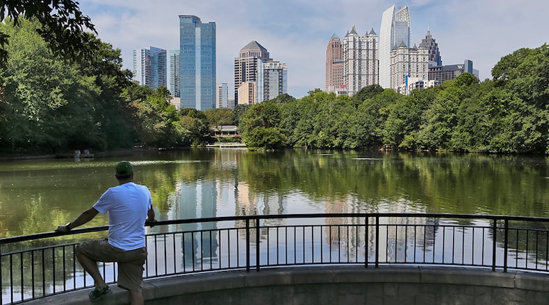 September 13, 2013 Atlanta: Charlie Saye took in the great view of midtown from at Piedmont Park's Lake Clara Meer Friday. A cold front moving through Georgia early Friday will bring noticeably cooler weather to metro Atlanta for the weekend. Channel 2 meteorologist Karen Minton said the weekend will also be dry and less humid, with highs in the low 80s and lows dipping into the low 60s. Atlantans will have plenty of venues to spend their weekend as the Braves have a weekend series against the Padres. The Falcons take on the Rams at 1 p.m. Sunday in the first regular season game at the Georgia Dome. Next door to the Dome, Sesame Street Live: Can't Stop the Singing moves into Philips Arena for two shows Friday, three Saturday and two Sunday. Other weekend events include the Clark-Atlanta University vs. Stillman College football game at 6 p.m. Saturday at Panther Stadium, the For Sisters Only festival Saturday at the Georgia World Congress Center, the Atlanta Arts Festival Saturday and Sunday at Piedmont Park, the One Music Fest, taking place Saturday at Masquerade Music Park and Historic Fourth Ward Park, and the Atlanta Bar-B-Q Festival Friday and Saturday at Atlantic Station. JOHN SPINK/JSPINK@AJC.COM