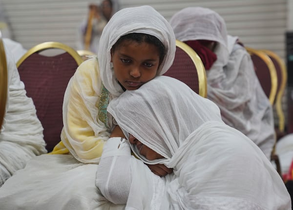 Congregants pray during a service at Re'ese Adbarat Debre Selam Kidist Mariam Church, an Ethiopian Orthodox Tewahedo church, in Washington, D.C., Saturday, April 5, 2025. (AP Photo/Jessie Wardarski)