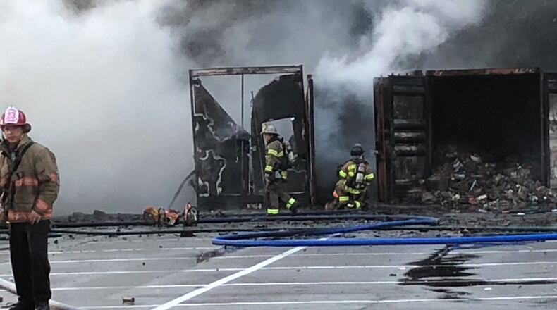Storage containers holding fireworks burst into flames at a South Carolina fireworks business.
