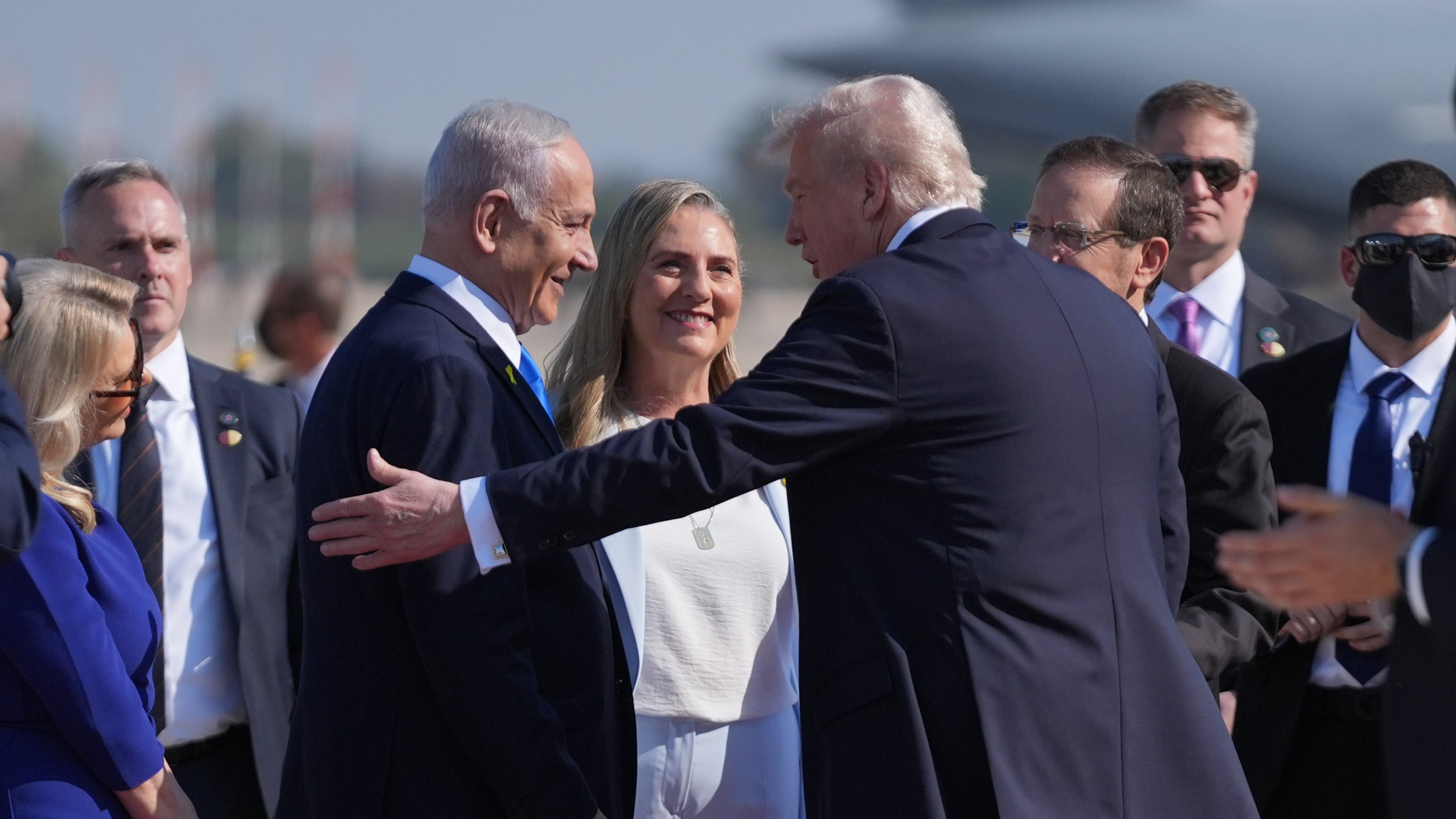 President Donald Trump greets Israel's Prime Minister Benjamin Netanyahu as he arrives at Ben Gurion International Airport, Monday, Oct. 13, 2025, near Tel Aviv. (AP Photo/Evan Vucci)