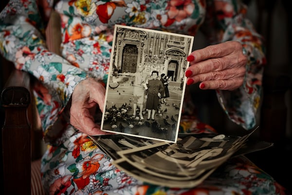 Marie-Pierre Pruvot known as Bambi, one of the first trans women in the world to become a public star, and a pioneer in global LGBTQ+ history, shows a photo of her with her mother during an interview with the Associated Press, in Pantin, outside Paris, Tuesday, May 20, 2025. (AP Photo/Thomas Padilla)