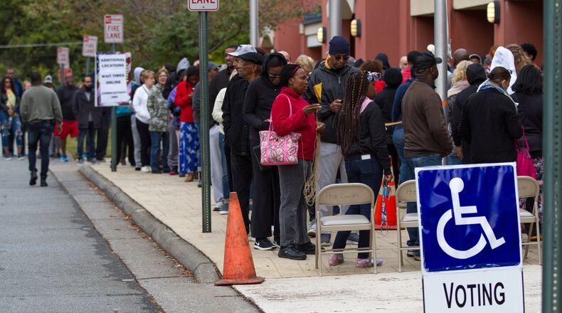 People wait in a long line to vote Saturday at the Cobb County Board of Elections and Registration office in Marietta, GA October 27, 2018. STEVE SCHAEFER / SPECIAL TO THE AJC