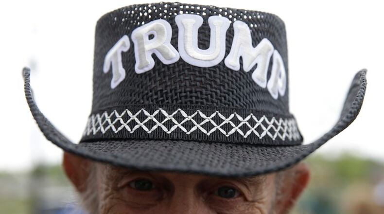 Danny Buechler of Greenfield, Ind., sports a Trump hat before a rally for Republican presidential candidate Donald Trump in Carmel, Ind., Monday, May 2, 2016. (AP Photo/Michael Conroy)