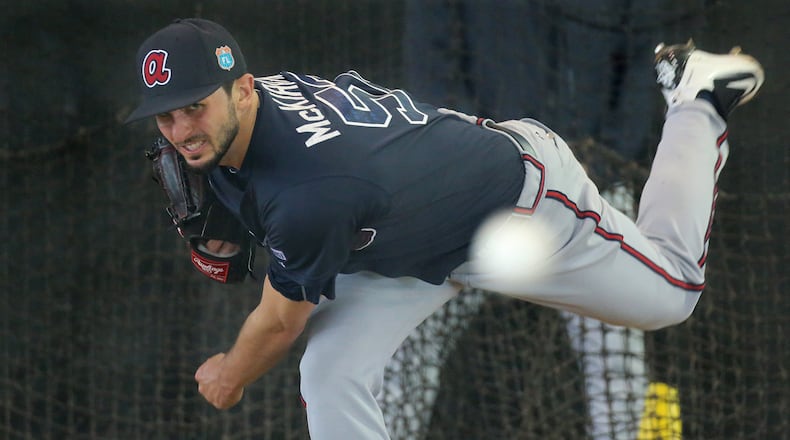 022416 LAKE BUENA VISTA: Braves pitcher Andrew McKirahan delivers a pitch working in the batting cages on Wednesday, Feb 24, 2016, at the ESPN Wide World of Sports, Lake Buena Vista, FL. Curtis Compton / ccompton@ajc.com