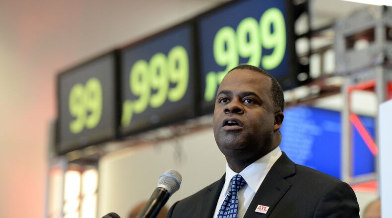 DECEMBER 27, 2015 ATLANTA Atlanta Mayor Kasim Reed gives remarks during the ceremony. Hartsfield-Jackson International Airport awarded its 100 millionth passenger for 2015 with prizes including a new car, two free airline tickets and a small crowd of officials and television cameras early Sunday December 27, 2015. The Atlanta airport — the world’s busiest — is the first airport in the world to handle 100 million passengers in a year. “It’s our commitment that we maintain our position as the world’s most traveled airport,” said Atlanta Mayor Kasim Reed during remarks at the airport before the flight arrived Sunday morning. The winner, a man from Biloxi named Larry Kendrick who arrived at the airport in blue jeans, an orange t-shirt and a baseball cap, was surprised to learn upon landing that he had been selected as the 100 millionth passenger. KENT D. JOHNSON/ kdjohnson@ajc.com