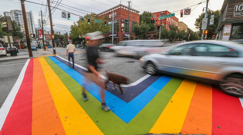 Motorists and pedestrians had a brand new perspective of 10th and Piedmont Avenue in 2015. There was aproject to paint rainbow crosswalks in Midtown for the launch of Atlanta Pride. JOHN SPINK /JSPINK@AJC.COM