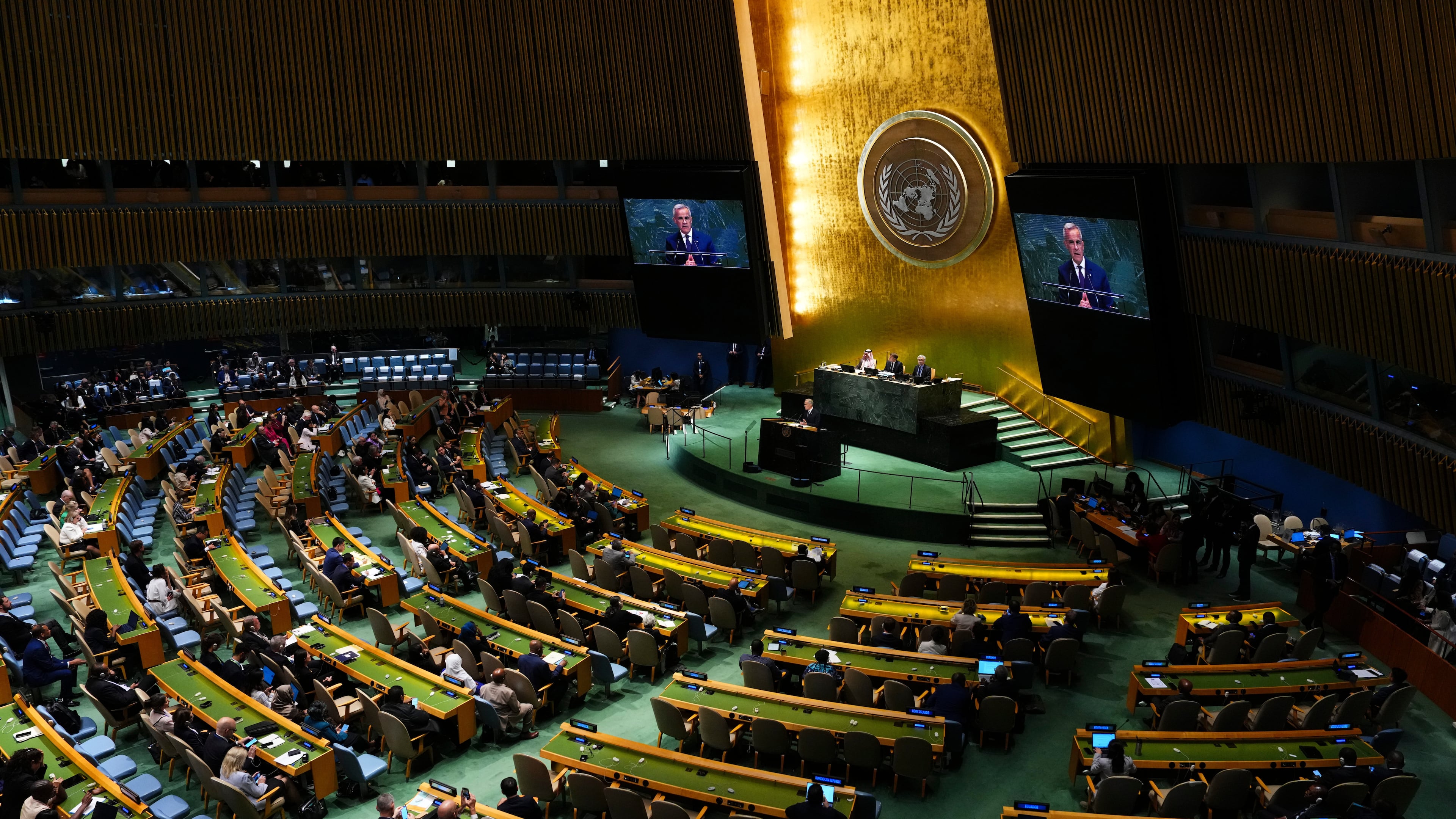 Canada's Prime Minister Mark Carney delivers a speech as he takes part in a high-level international conference for the peaceful settlement of Palestinians and the implementation of the two-state solution during the United Nations General Assembly at U.N. headquarters, Monday, Sept. 22, 2025. (Sean Kilpatrick/The Canadian Press via AP)