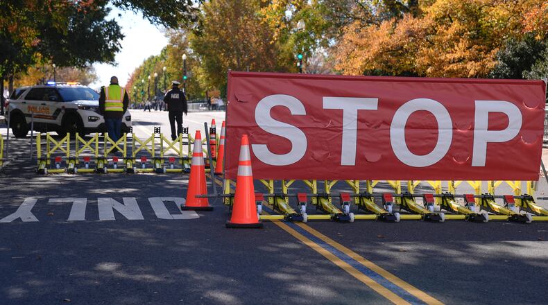 The roadway in front of the Supreme Court and U.S. Capitol is closed to traffic on the 36th day of the government shutdown on Capitol Hill, Wednesday, Nov. 5, 2025, in Washington. (AP Photo/Mariam Zuhaib)