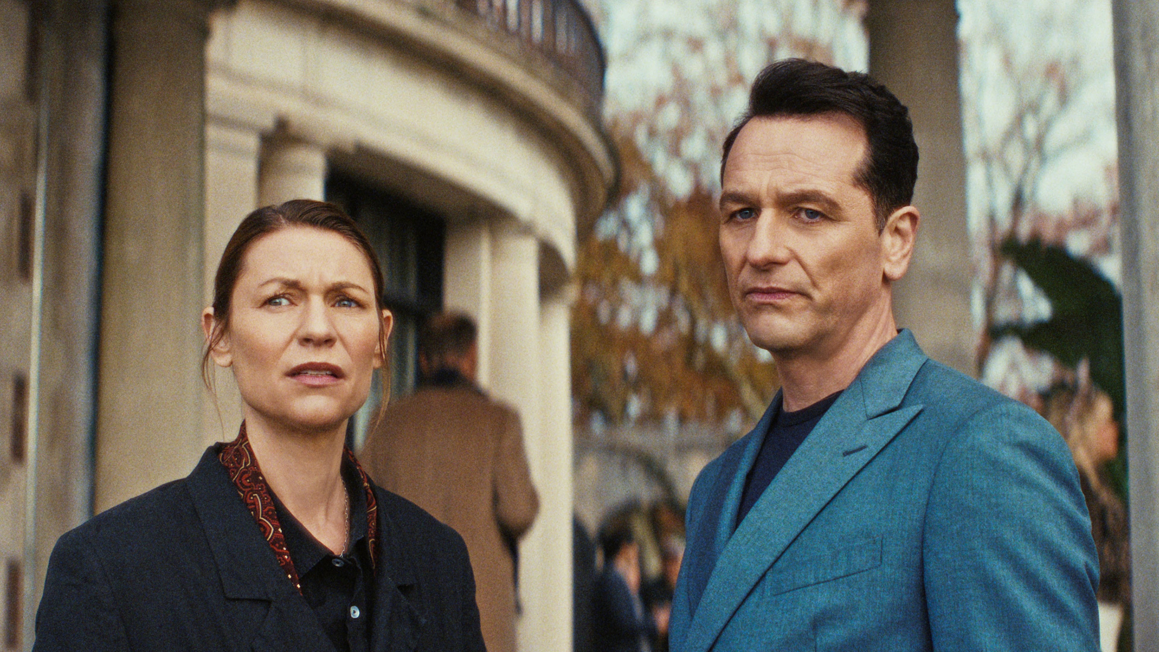 This image released by Netflix shows Claire Danes, left, and Matthew Rhys in a scene from "The Beast in Me." (Netflix via AP)