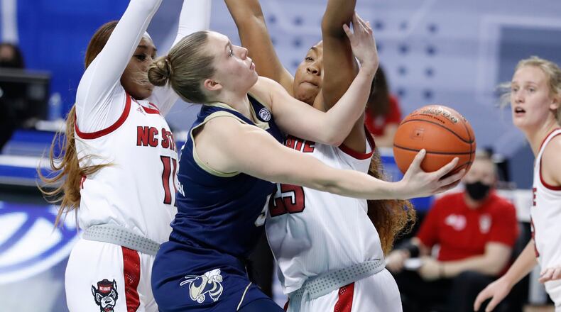 Georgia Tech's Lotta-Maj Lahtinen (31) shoots as North Carolina State's Kayla Jones (25) during the first half of an NCAA college basketball game in the semifinals of Atlantic Coast Conference tournament in Greensboro, N.C., Saturday, March 6, 2021. (Ethan Human/The News & Observer via AP)