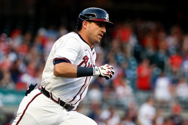 Atlanta Braves' Austin Riley runs to first base on a double during the first inning of a baseball game against the Cincinnati Reds, Thursday, May 8, 2025, in Atlanta. (AP Photo/Butch Dill)