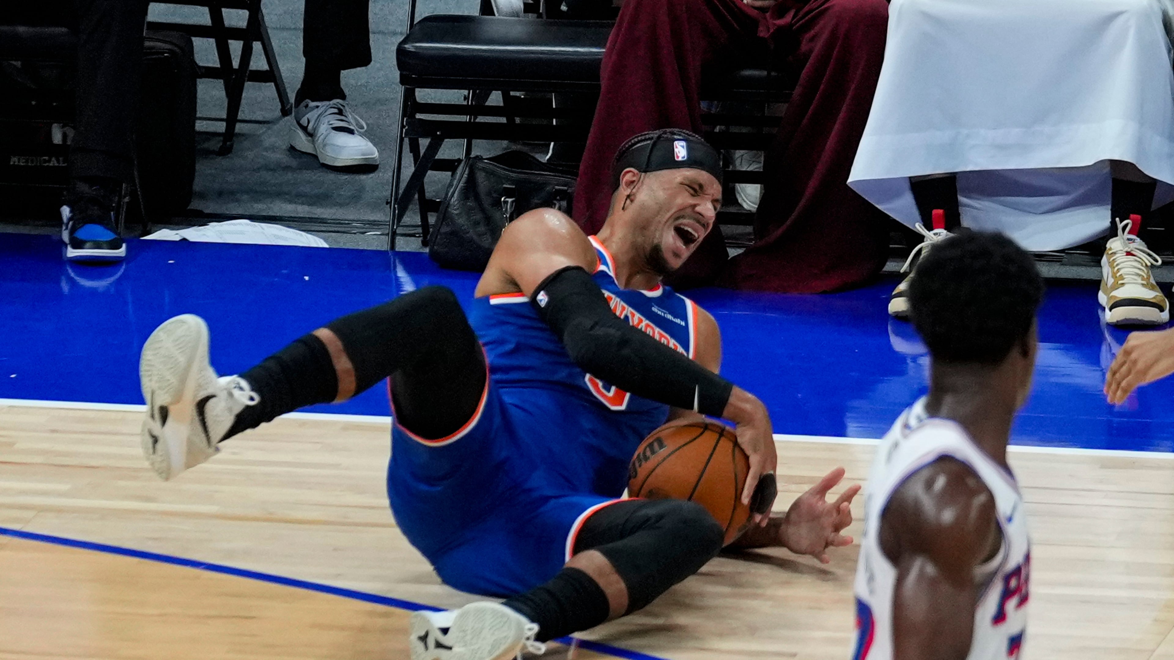 New York Knicks' Josh Hart reacts as he falls during the first half of an NBA preseason basketball game against the Philadelphia 76ers, Thursday, Oct. 2, 2025, in Abu Dhabi, United Arab Emirates. (AP Photo/Altaf Qadri)