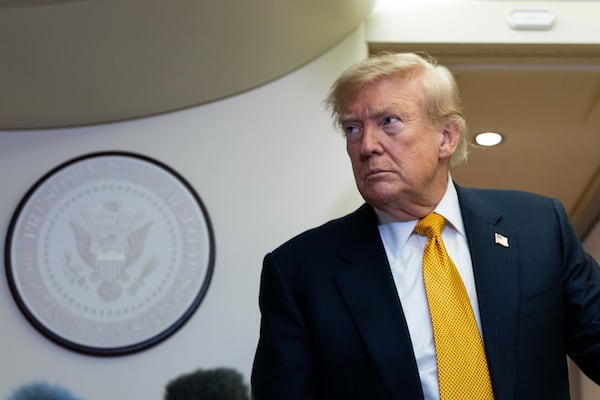 President Donald Trump speaks with reporters on Air Force One last week. (Alex Brandon/AP)