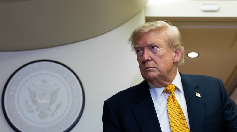 President Donald Trump speaks with reporters in flight on Air Force One after landing at U.S. Air Force Base at RAF Mildenhall, in Suffolk, Eastern England, Wednesday, July 8, 2026. (AP Photo/Alex Brandon)