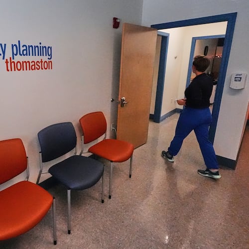 FILE - Vanessa Shields-Haas, a nurse practitioner, walks from the lobby toward the examination rooms at the Maine Family Planning healthcare facility, July 15, 2025, in Thomaston, Maine. (AP Photo/Charles Krupa, File)