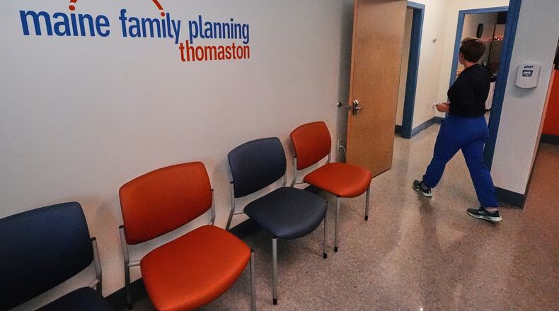FILE - Vanessa Shields-Haas, a nurse practitioner, walks from the lobby toward the examination rooms at the Maine Family Planning healthcare facility, July 15, 2025, in Thomaston, Maine. (AP Photo/Charles Krupa, File)