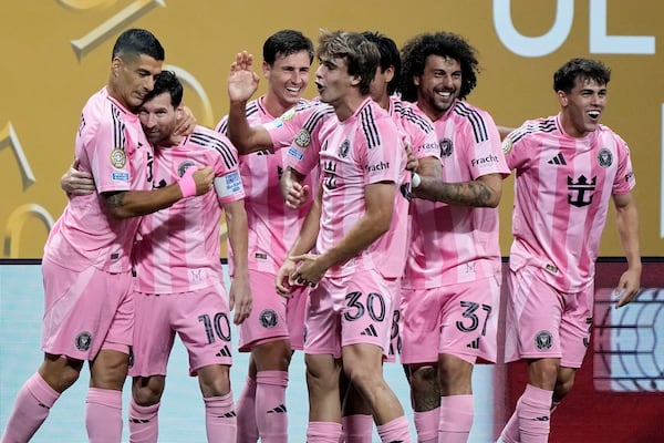 Inter Miami's Lionel Messi, second left, celebrates with Luis Suarez after scoring his side's second goal during the Club World Cup group A soccer match between Inter Miami and FC Porto in Atlanta, Thursday, June 19, 2025. (AP Photo/Brynn Anderson)