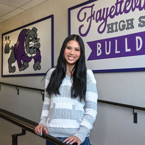Fayetteville High senior Lily Alder, president of the Young Democrats of Arkansas, is photographed in the halls at Fayetteville High School Tuesday, April, 7, 2026 in Fayetteville, Ark. (AP Photo/Michael Woods)