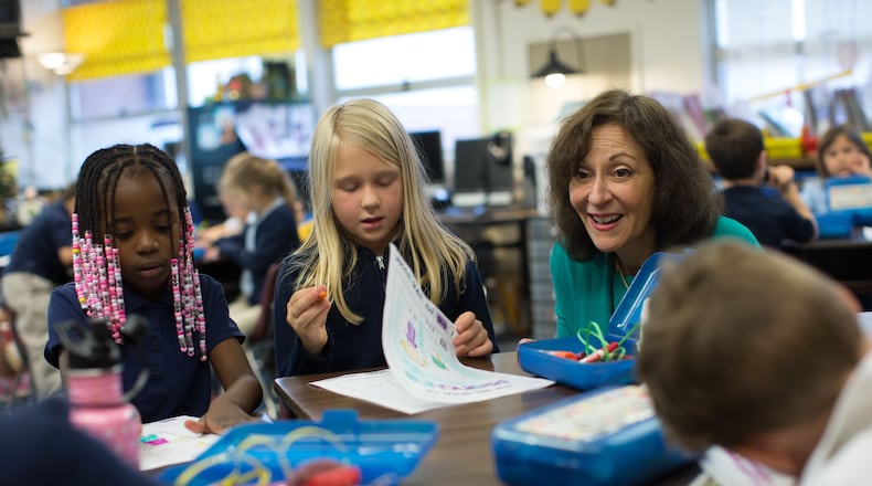 Marietta City Schools Superintendent Dr. Emily Lembeck talks with 1st grade students of Carrie Reeser, a former elementary student of Lembeck's, at West Side Elementary, Wednesday, Nov. 30, 2016, in Marietta, Ga.  BRANDEN CAMP/SPECIAL