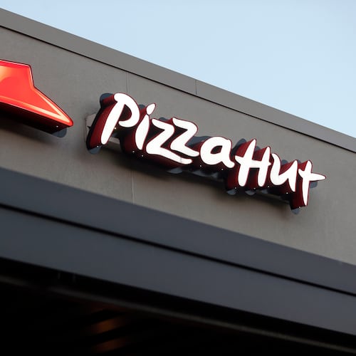 FILE - This Dec. 15, 2016, file photo shows a Pizza Hut restaurant in New Orleans. (AP Photo/Gerald Herbert, File)