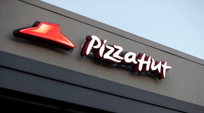FILE - This Dec. 15, 2016, file photo shows a Pizza Hut restaurant in New Orleans. (AP Photo/Gerald Herbert, File)