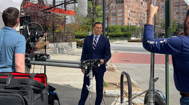 Justin Farmer in the field while working at WSB-TV. CONTRIBUTED