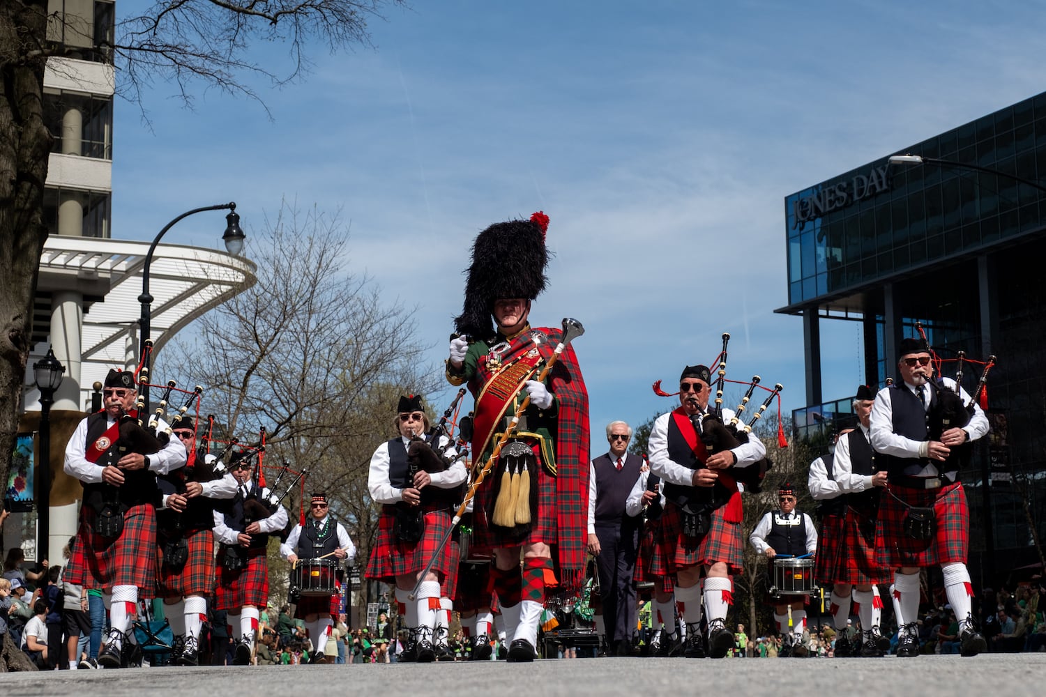 A bagpipe and drum band makes its way down Peachtree Street during the Atlanta St. Patrick’s Parade on Saturday, March 14, 2026. (Ben Gray for the AJC)