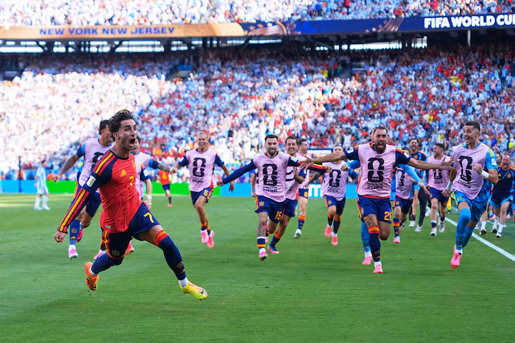 Spain's Ferran Torres (front left) celebrates scoring their first goal during the World Cup final soccer match between Spain and Argentina in East Rutherford, N.J., near New York, Sunday, July 19, 2026. (Julio Cortez/AP)