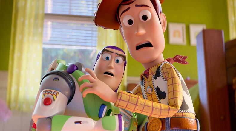 This image released by Disney shows characters Buzz Lightyear, voiced by Tim Allen, left, and Woody, voiced by Tom Hanks, in a scene from "Toy Story 5." (Pixar-Disney via AP)
