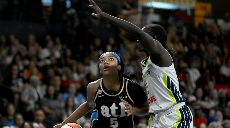 Atlanta Dream forward Angel Reese drives against the Dallas Wings in May. In Thursday's game against the Liberty, Reese scored a season high 25 points. (Hyosub Shin/AJC)