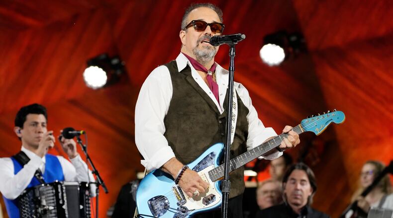 FILE - Frontman Raul Malo, center, and The Mavericks perform during the Boston Pops Fireworks Spectacular in Boston on July 4, 2024. (AP Photo/Michael Dwyer, File)