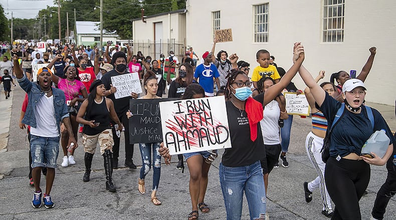 Residents participate in an impromptu peaceful march in Brunswick on June 4, 2020. A judge found probable cause against three suspects in the death of Ahmaud Arbery, so the case was bound over to Superior Court. Jackie Johnson, Brunswick’s district attorney, got the boot on Election Day last week largely because of her connection to the Arbery case. (ALYSSA POINTER / alyssa.pointer@ajc.com)