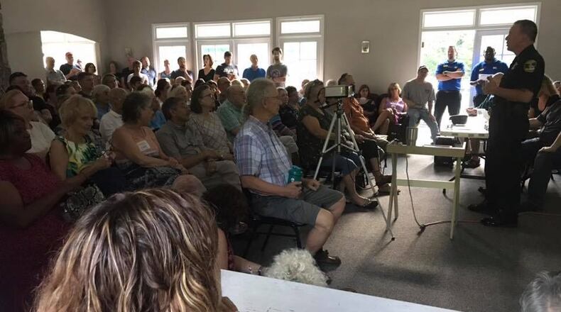 Police Chief Billy Grogan (right) speaks to a packed room of neighbors in the Dunwoody North Civic Association.