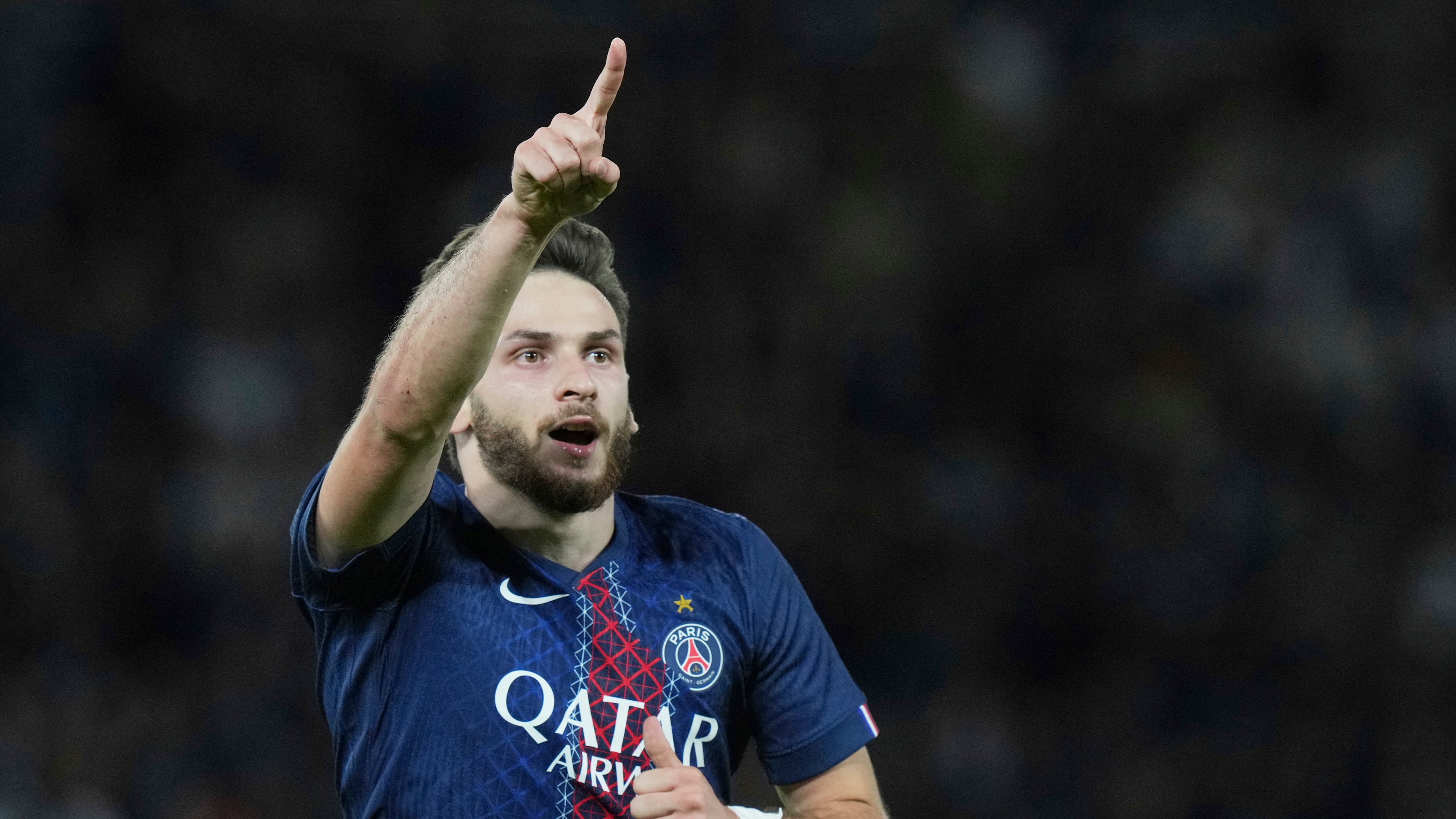PSG's Khvicha Kvaratskhelia celebrates after scoring his side's second goal during the Champions League opening phase soccer match between Paris Saint-Germain and Atalanta at the Parc des Princes stadium in Paris, France, Wednesday, Sept. 17, 2025. (AP Photo/Thibault Camus)
