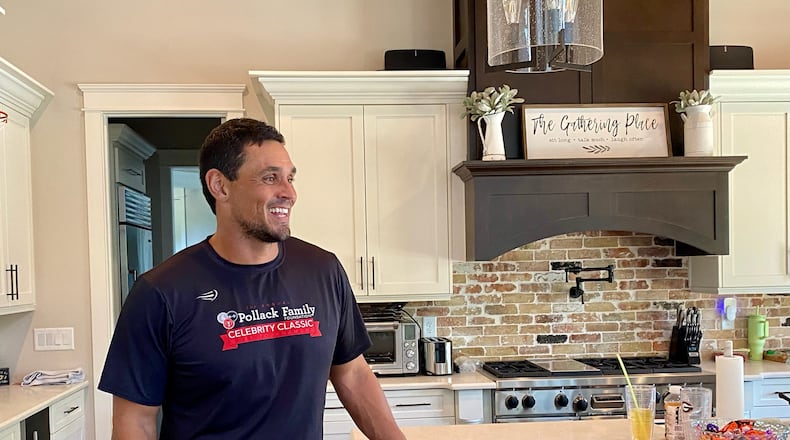 Georgia great and College Football Hall of Famer David Pollack speaks with a visitor to his Oconee County home in September 2024. (AJC photo by Ken Sugiura)