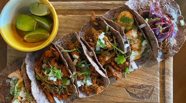 Tacos at D Boca N Boca include (from left) chicken, mushroom, chorizo, al pastor, shrimp and beef. Ligaya Figueras/ligaya.figueras@ajc.com