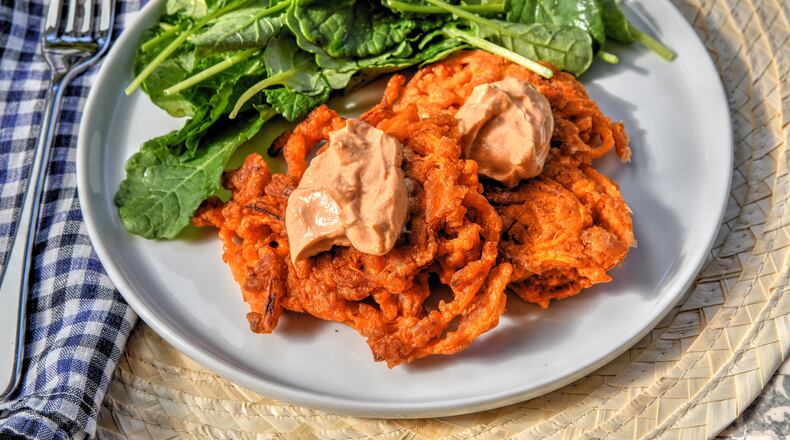 Quick Vegetable Fritters with Smoky Yogurt Topping. (Chris Hunt for The Atlanta Journal-Constitution)