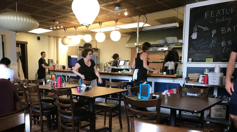 Café 458 feels like a cramped diner. During the week, the space serves as a resource center for the homeless. But on Sundays it operates as a fully functioning restaurant staffed by volunteers. Photo credit: Ligaya Figueras