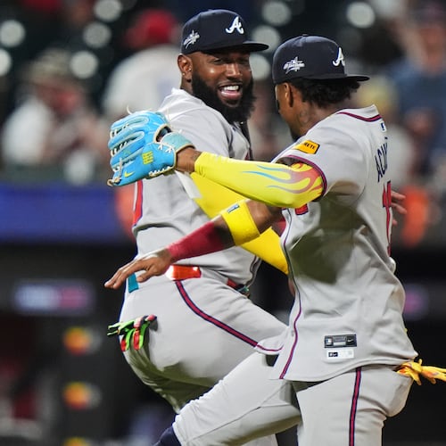 Atlanta Braves' Marcell Ozuna, left, celebrates with Ronald Acuña after a baseball game against the New York Mets Tuesday, June 24, 2025, in New York. (AP Photo/Frank Franklin II)
