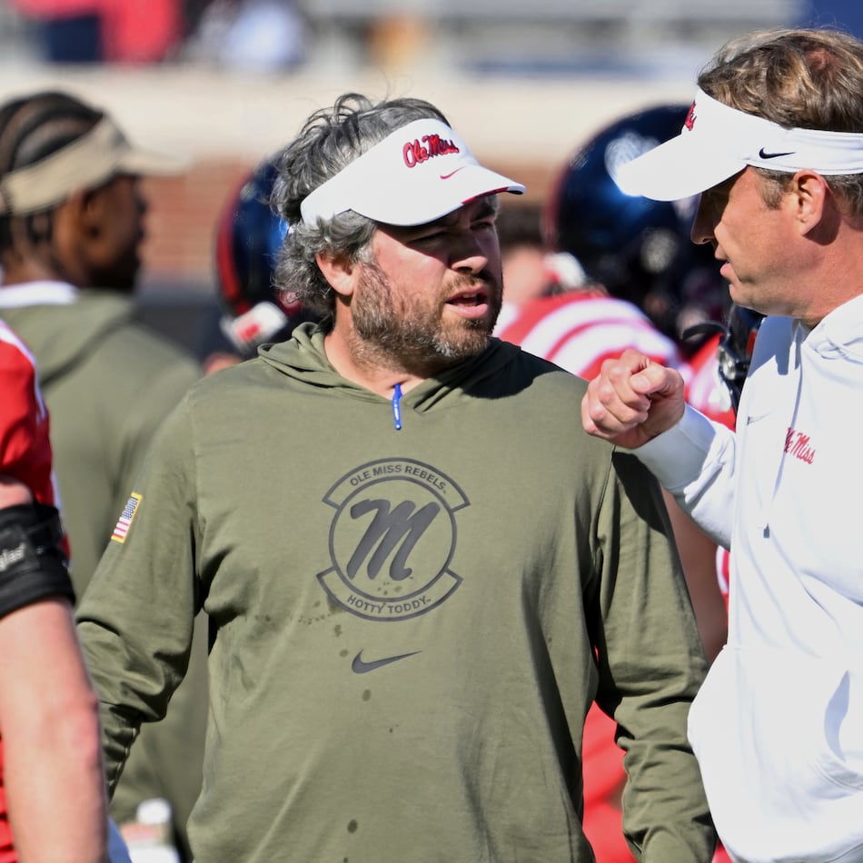 Mississippi defensive coordinator Pete Golding, left, and head coach Lane Kiffin talk during warm-ups before an NCAA college football game against Louisiana Monroe in Oxford, Miss., Saturday, Nov. 18, 2023. (Thomas Graning/AP)