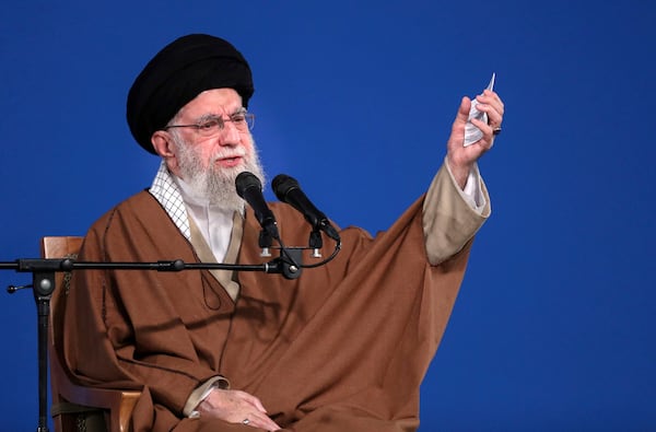 In this photo released by the official website of the office of the Iranian supreme leader, Supreme Leader Ayatollah Ali Khamenei speaks to a group of people and officials in Tehran, Iran, Friday, March 21, 2025. (Office of the Iranian Supreme Leader via AP)